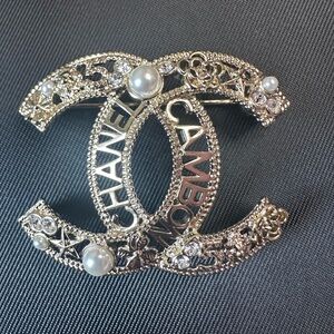 CHANEL Gold Brooch with Pearls and Crystals with leather zip up dusk cover